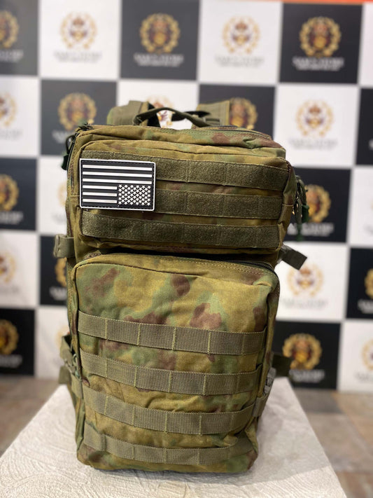 "Front view of military-style camouflage unisex backpack with tactical straps and USA flag patch"