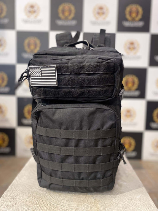 Front view of black tactical backpack with US flag patch and utility compartments