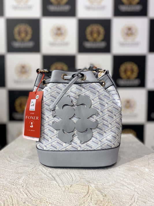 Elegant light grey FOXER handbag with crossbody strap and front design detail

