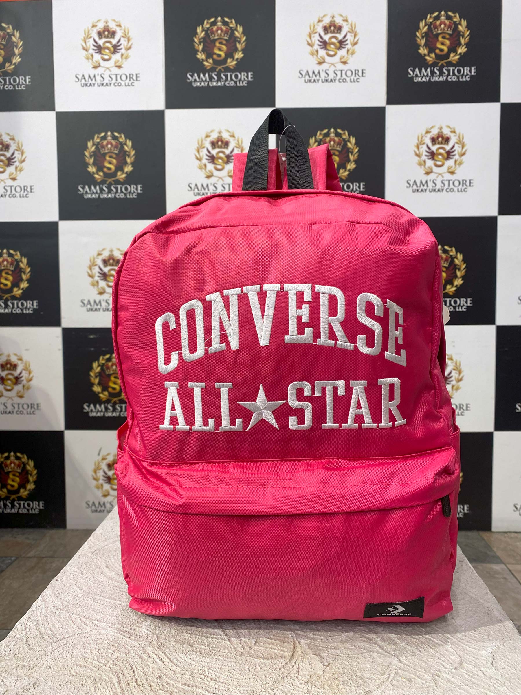 Front view of pink Converse All Star unisex backpack with white embroidered logo

