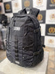 Front view of SDMN unisex black backpack with multi-zip pockets and modern style