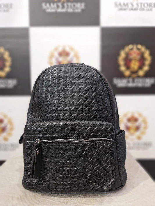 Small black faux leather ladies backpack with front zip and side pockets