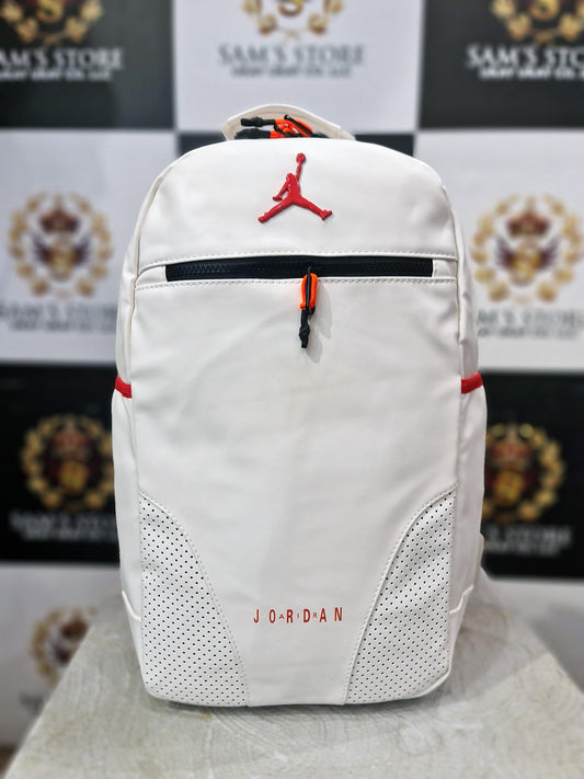 White Jordan-style backpack with red accents and dual zips