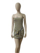 Front view of black, yellow, and white striped sleeveless mini dress with bow