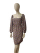 Front view of floral square-neck mini dress with puff sleeves