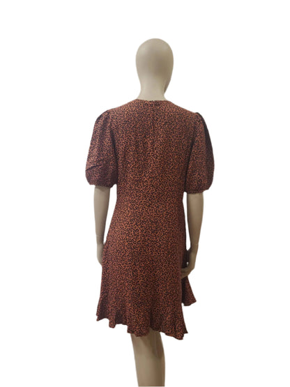 Back view of brown leopard mini dress with short sleeves and zip closure