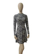 Front view of black and white zebra print long sleeve mini dress