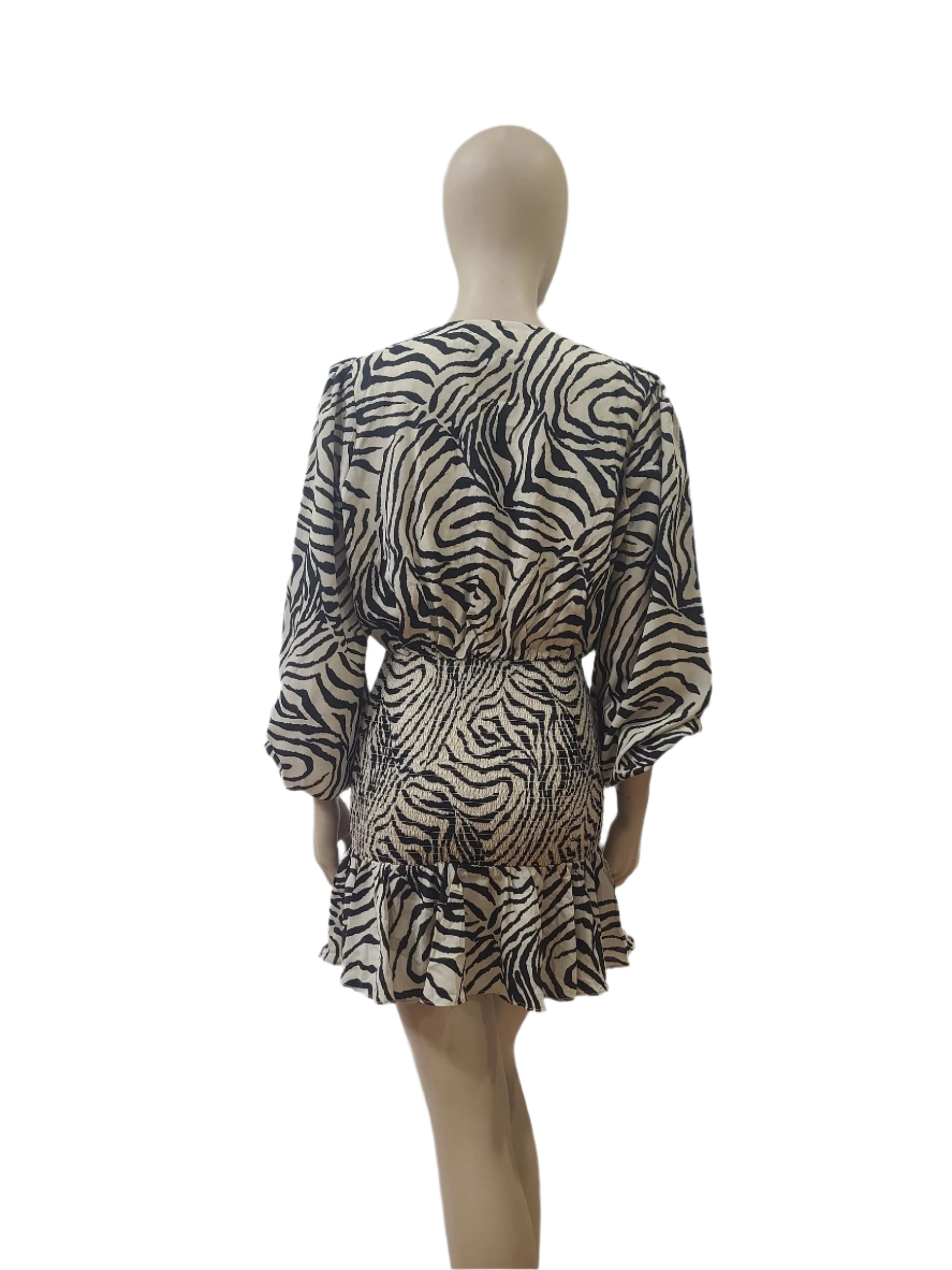 Back view of zebra mini dress in beige and black with full sleeves