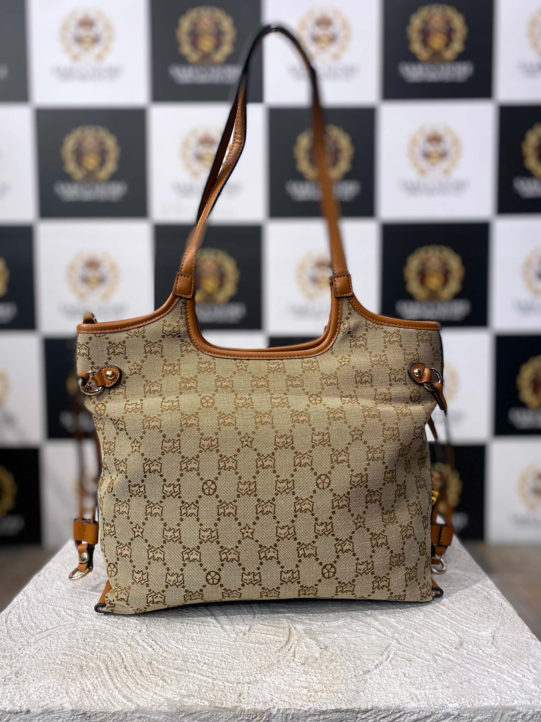 Front view of FOXER beige monogram hand bag with dual handles and tan leather accents